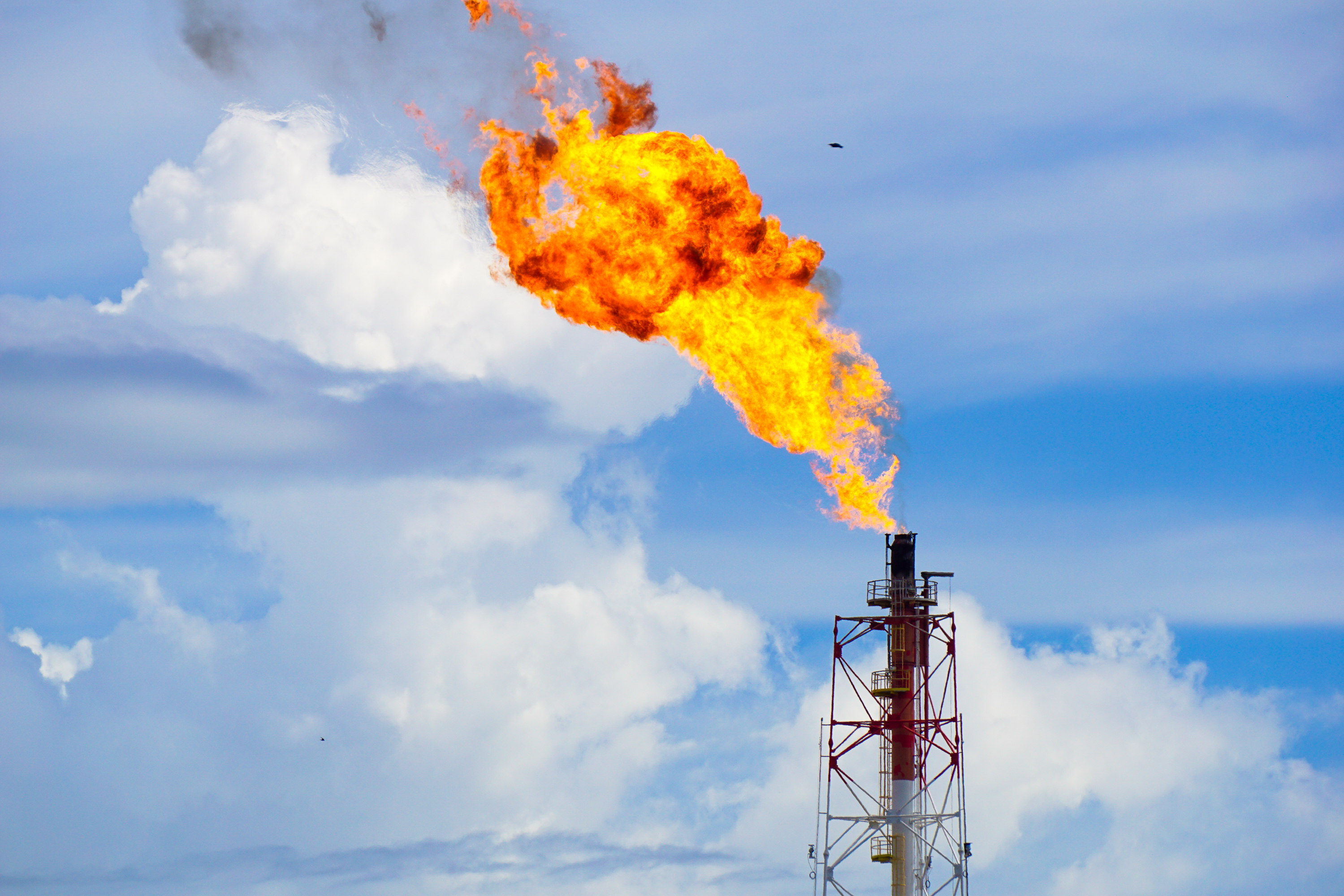 Gas flare at an oil refinery: the fossil fuel industry is a significant source of methane emissions and an important opportunity for mitigation.
