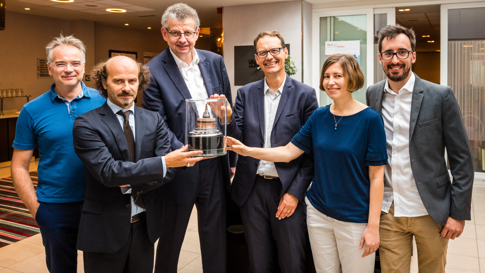 Partners of the Best Paths demonstration project presented a sample of the 3 GW superconducting cable in Brussels on 20 September 2018. In this picture: Stéphane Hole, ESPCI Paris; Matteo Tropeano, ASG Superconductors; Jean-Maxime Saugrain, Nexans France; Christian-Eric Bruzek, Nexans, France; Adela Marian, IASS Potsdam and Guillaume Escamez, Nexans, France.