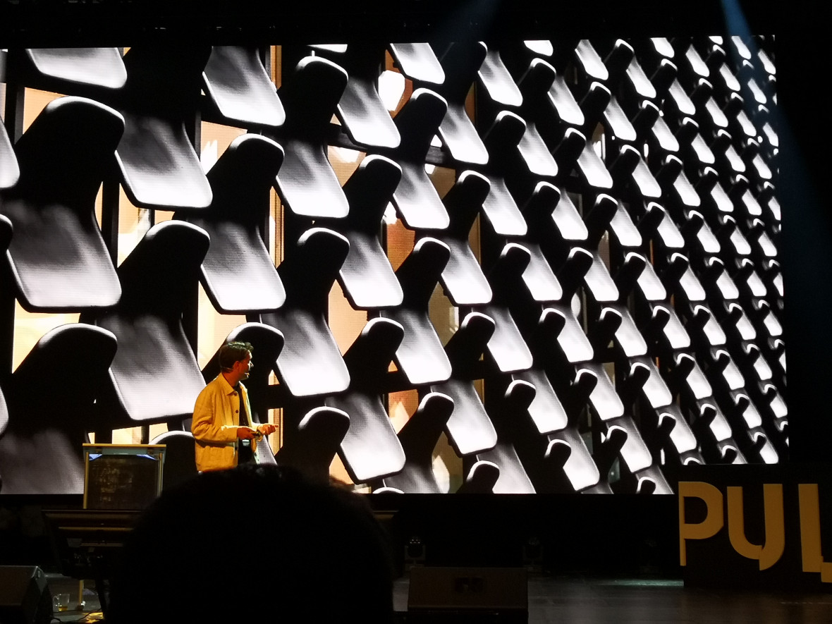 Zygmunt Borawski, architect, lecturer, and journalist, talking about reusing old chairs in a building facade.